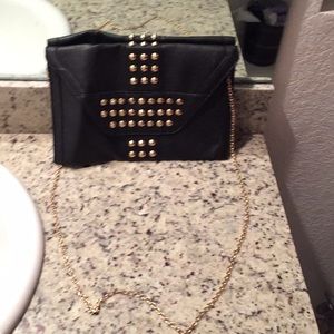Black studded clutch bag